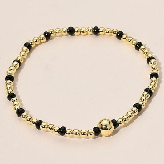 GOLD STAINLESS STEEL BLACK BEADED BRACELET