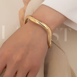 ZEPHYRINE GOLD WARPED BANGLE BRACELET
