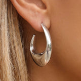 STERLING SILVER STAINLESS STEEL WARPED HOOP EARRINGS