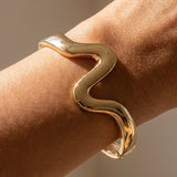TAMMI GOLD CURVED BANGLE BRACELET