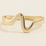 TAMMI GOLD CURVED BANGLE BRACELET